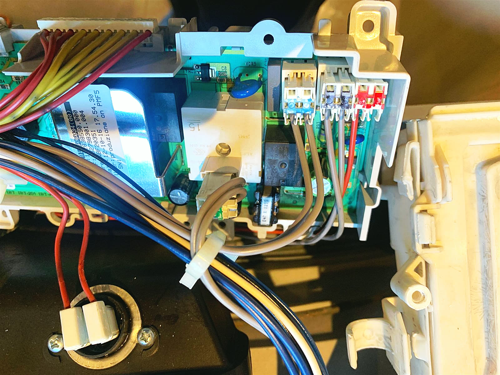 Washing machine control module and wiring being checked