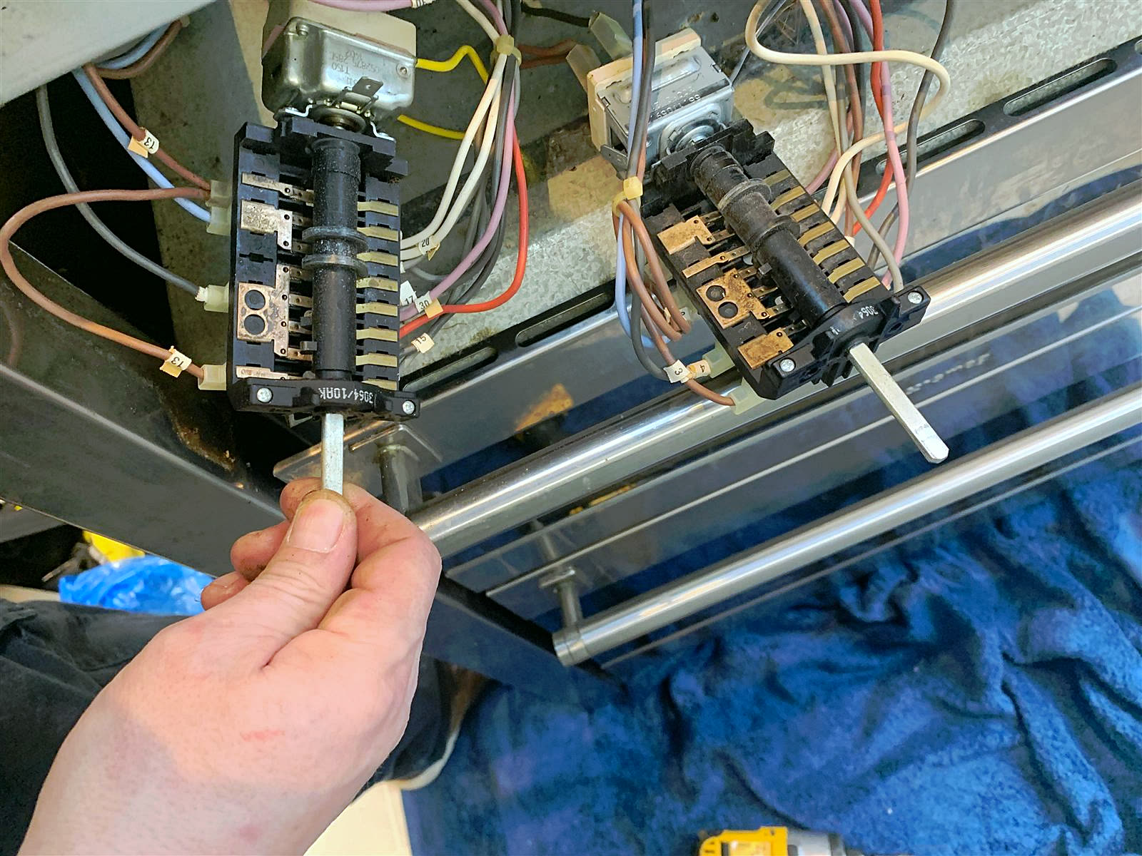 Electric oven selector switch being replaced