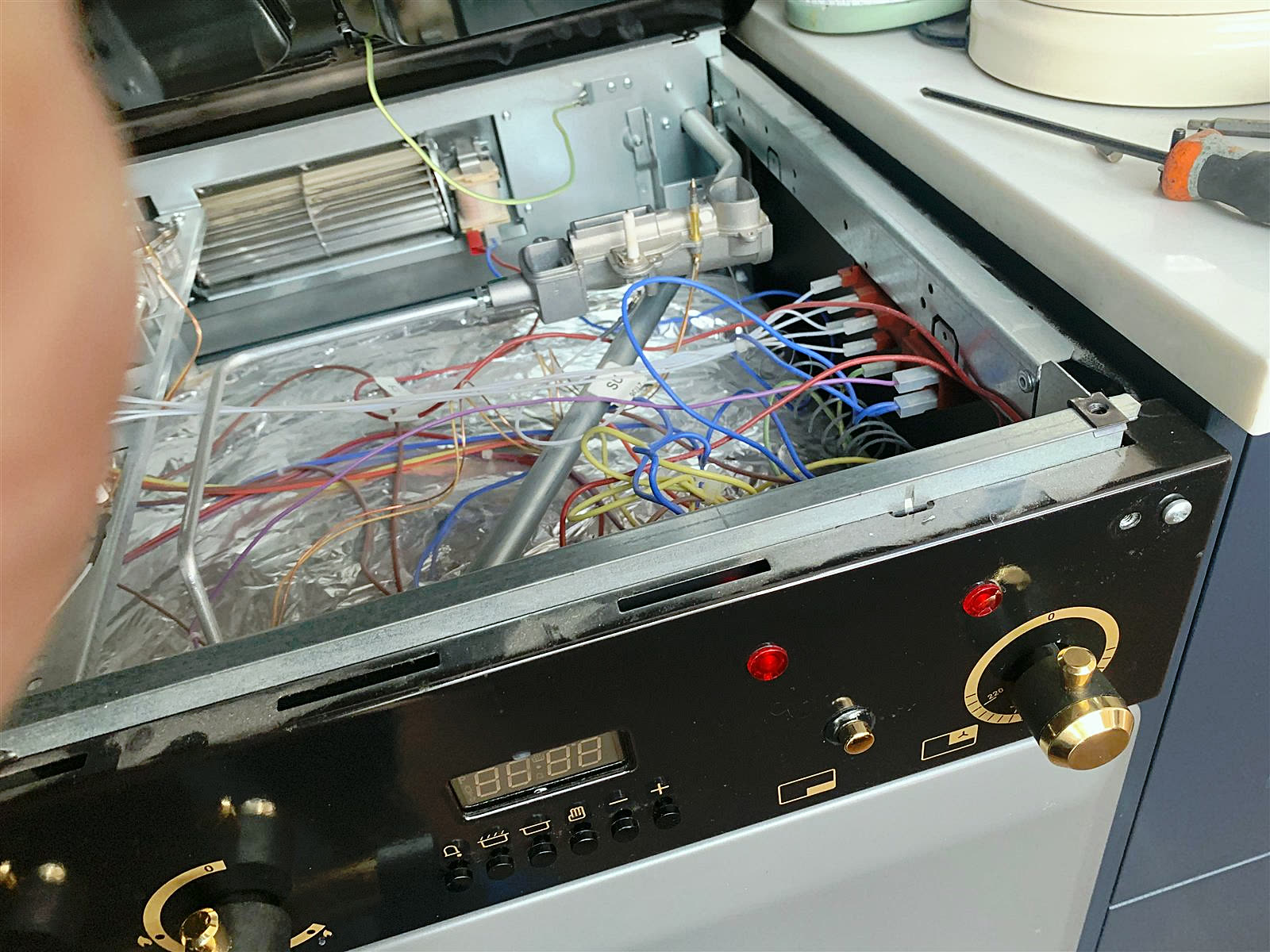 Electric cooker opened up, fan heater and wiring