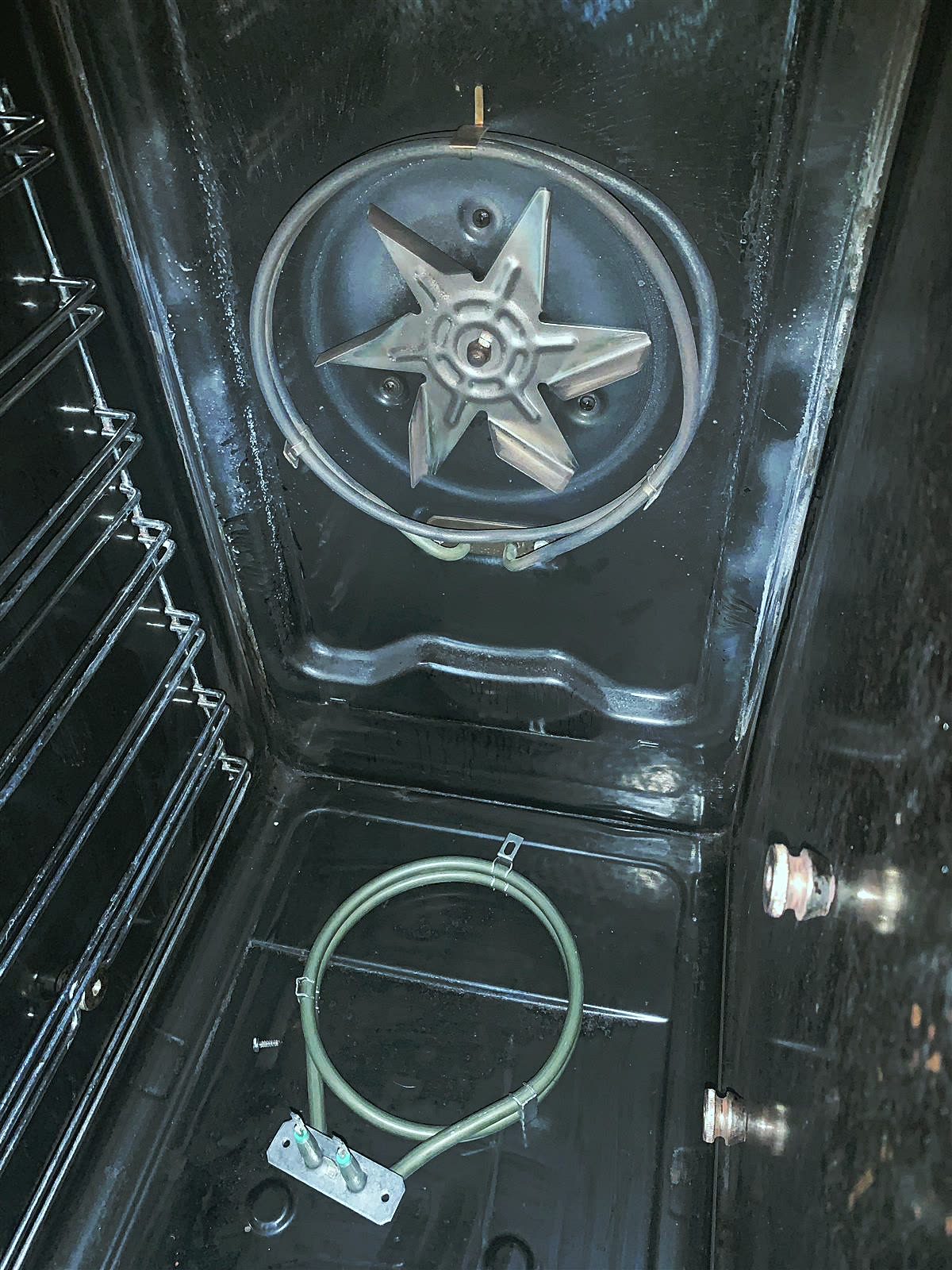 Electric fan oven interior with the fan and heating element